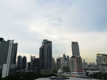 Modern buildings in city against sky