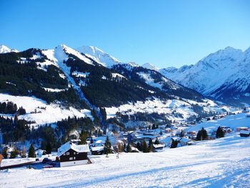 Scenic view of snowcapped mountains against clear sky