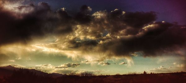 Scenic view of landscape against cloudy sky