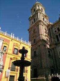 Low angle view of building against blue sky