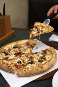 Close-up of pizza served on table