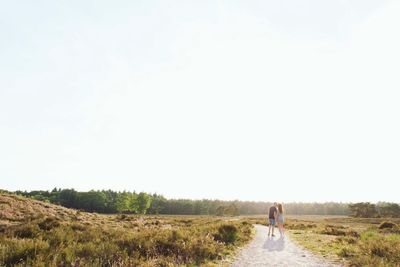 Rear view of couple kissing outdoors