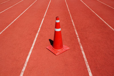 High angle view of traffic cone on running track