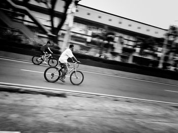 Blurred motion of man riding bicycle