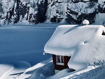 High angle view of house on snow covered land