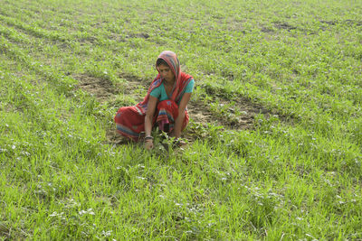 Indian woman farmer working at agricultural field