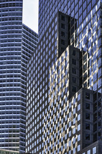 Low angle view of modern buildings against sky