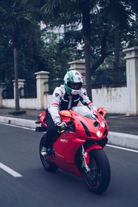 Man riding motorcycle on road