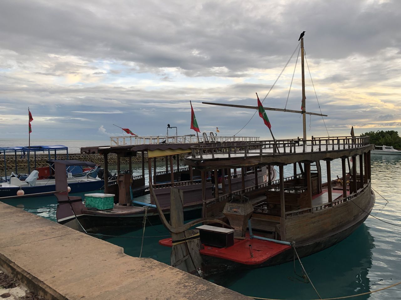 FISHING BOATS MOORED AT HARBOR