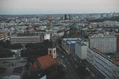 High angle view of modern buildings in city against sky