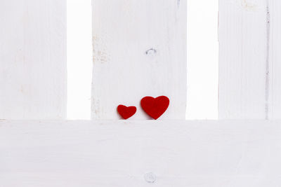 Close-up of heart shape on white wall