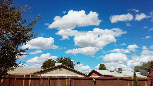 Low angle view of building against cloudy sky