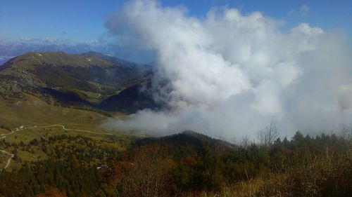 Panoramic view of landscape against cloudy sky