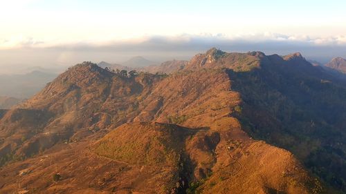 Scenic view of mountains against sky during sunset