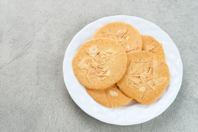 Almond crispy cookies with grated cheese, thin texture
