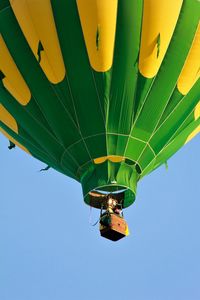 Low angle view of balloons against sky