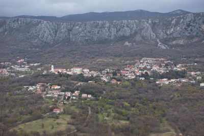 High angle view of townscape against mountains