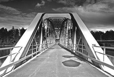 View of suspension bridge against cloudy sky