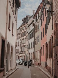 Street amidst buildings in city against sky