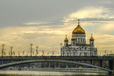 Built structure against cloudy sky at sunset