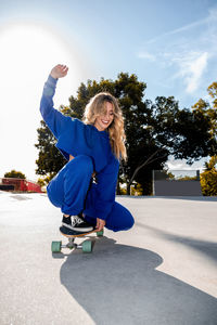 Smiling woman skating at park