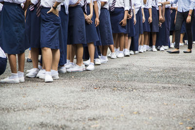 Low section of women standing on floor