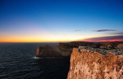 Scenic view of sea against sky at sunset