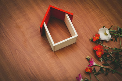 High angle view of red flower on table