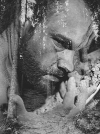 Close-up portrait of man sculpture in water