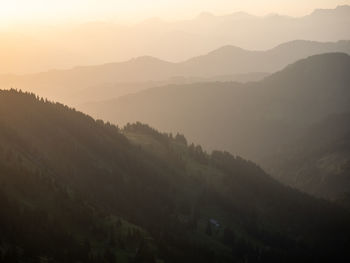 Scenic view of mountains against sky during sunset