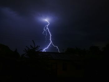 Low angle view of lightning in sky at night