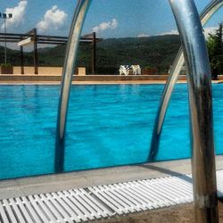 Swimming pool against blue sky