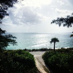 Scenic view of sea against cloudy sky