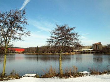 Scenic view of lake against sky during winter