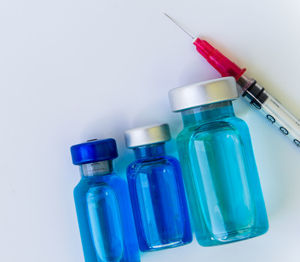 Close-up of bottles against white background