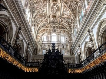 Low angle view of ornate ceiling in temple