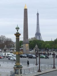 Tower in city against sky