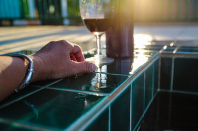 Hand holding glass of wine