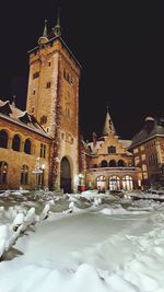 View of historic building against sky during winter at night