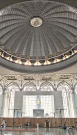 Low angle view of illuminated chandelier in building