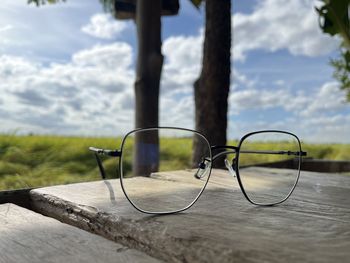 Close-up of eyeglasses on beach