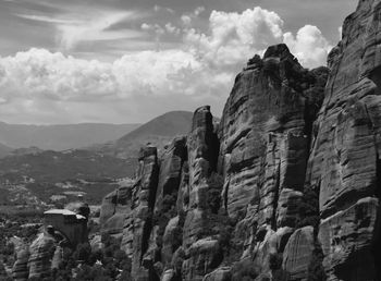 Scenic view of mountains against cloudy sky