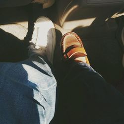 Low section of man standing in bus