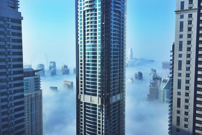 Skyscrapers covered in fog