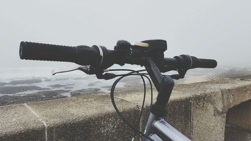 Bicycle on wheel against clear sky