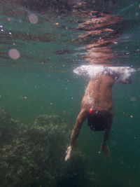 Man swimming in sea