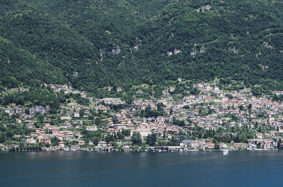 Aerial view of city by sea