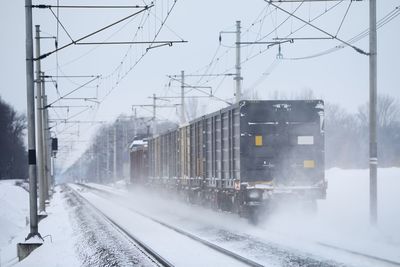 Train on railroad tracks in winter