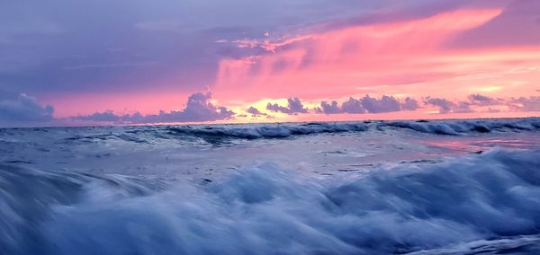 Panoramic view of sea against sky during sunset