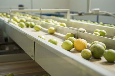Close-up of fruits in container on table
